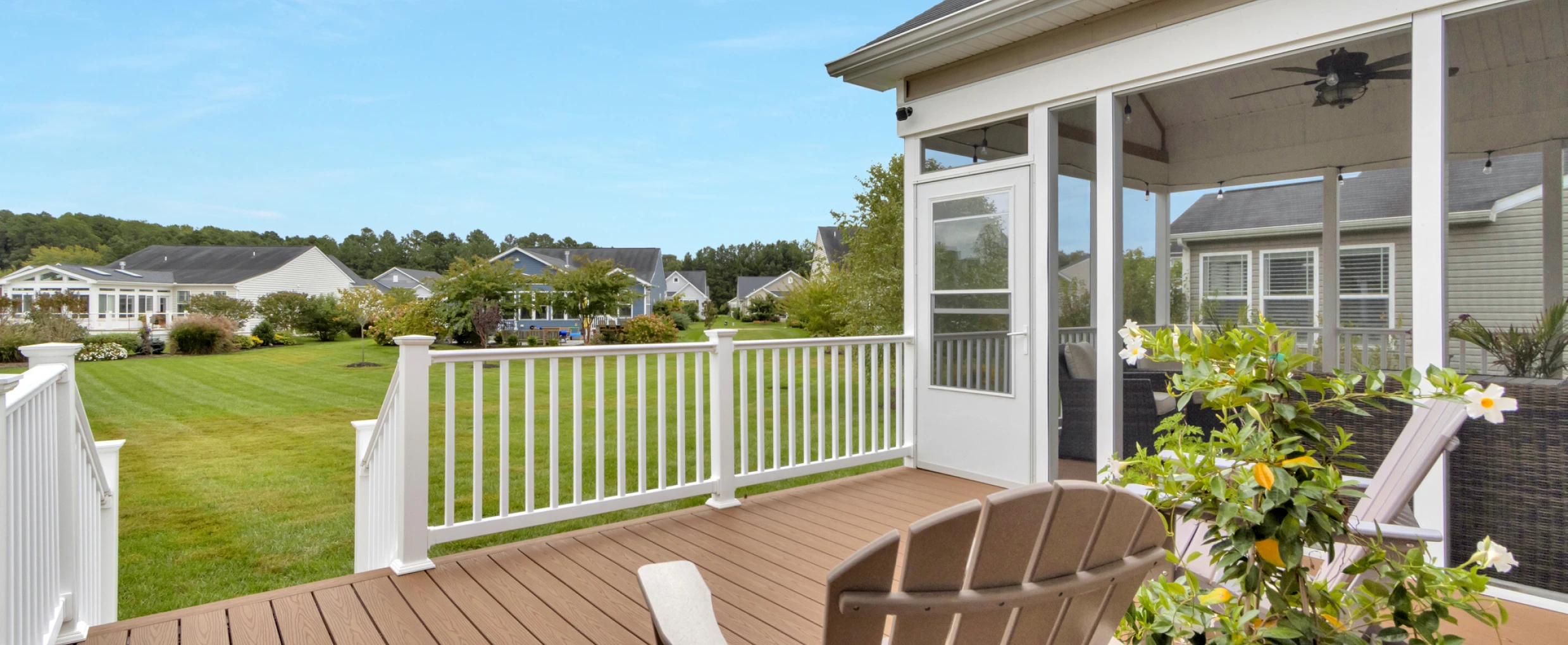 Screened porch overlooking green lawn