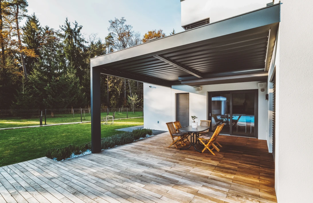 Modern patio with wooden deck and chairs
